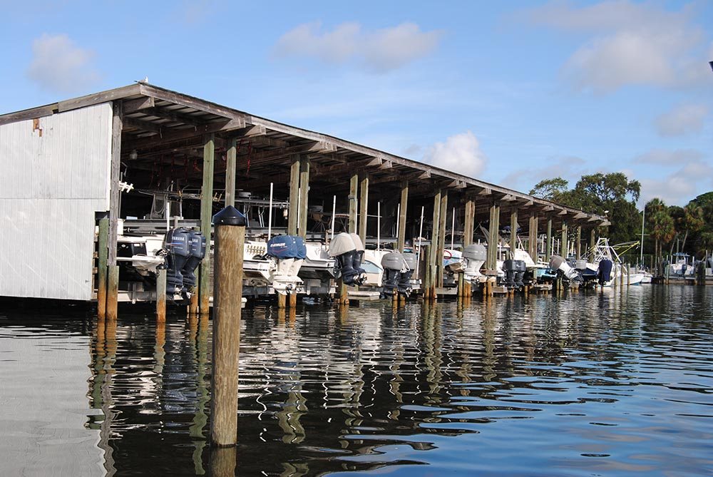 The covered slip row from the water.
