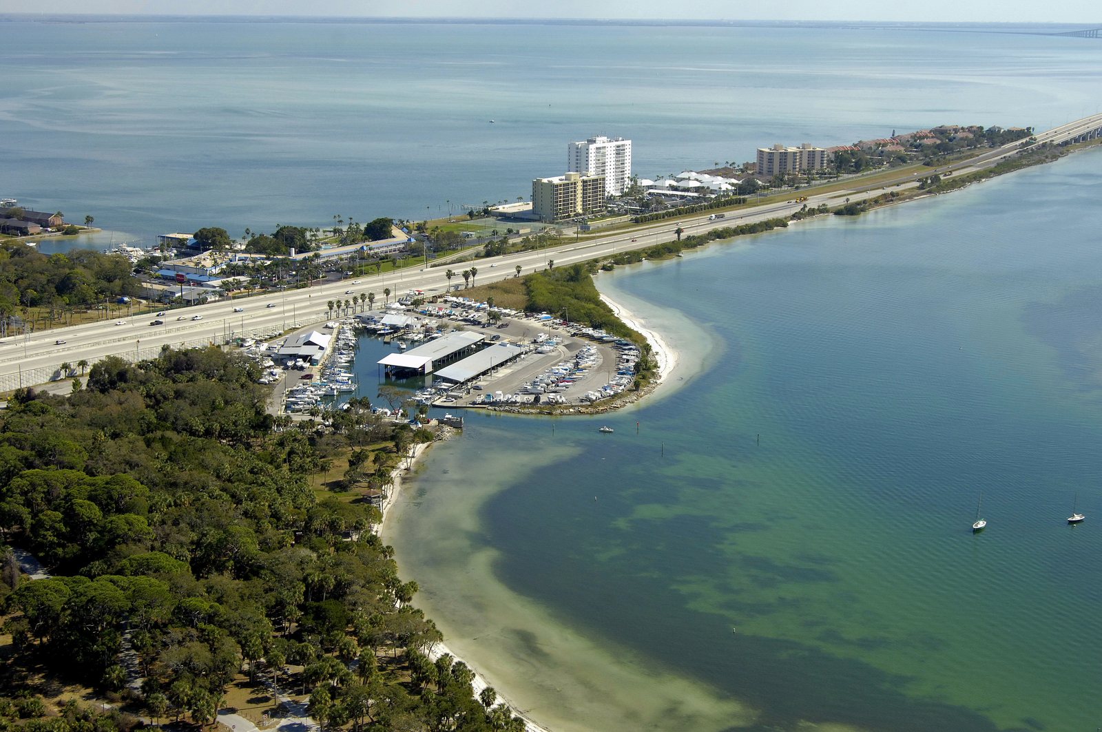 Aerial view of O'Neill's Marina at the mouth of Tampa Bay, St. Petersburg, with the Sunshine Skyway Bridge beyond.